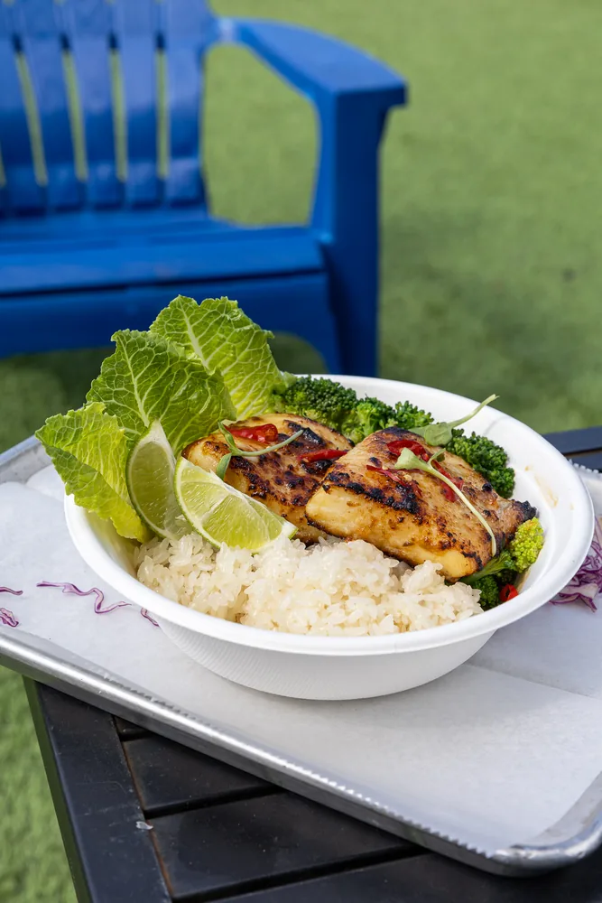 Thai grilled fish rice bowl outdoors