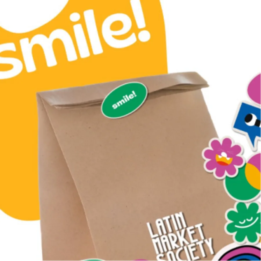 Smile — a kraft snack bag covered in stickers