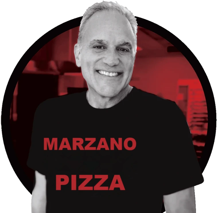 Louis, founder of Marzano Pizza, wearing a Marzano Pizza tee — Anytown, ST
