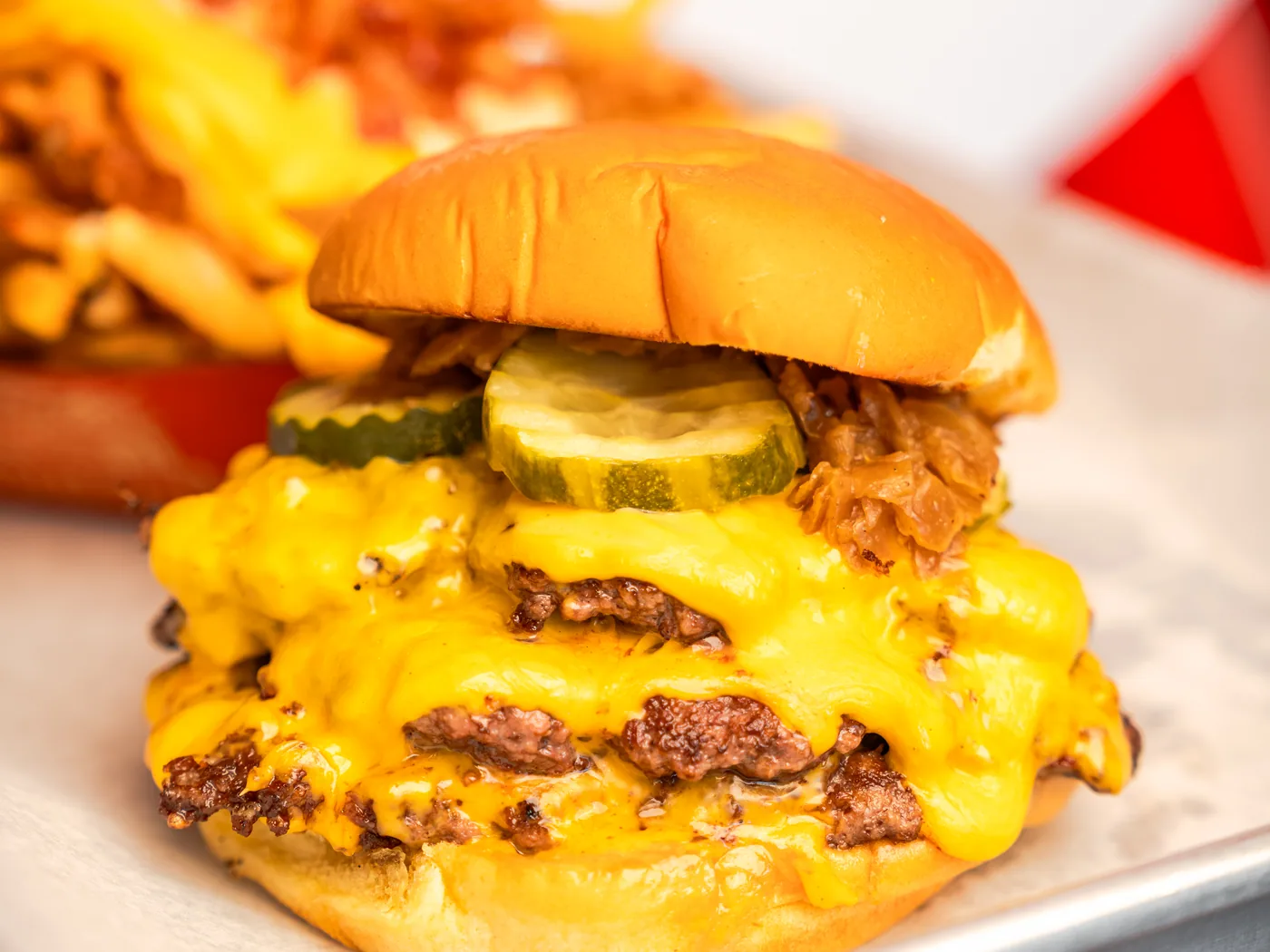 A Ember double smash burger on a tray