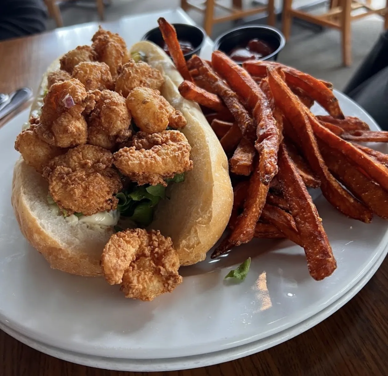 Fried shrimp po’boy with sweet potato fries