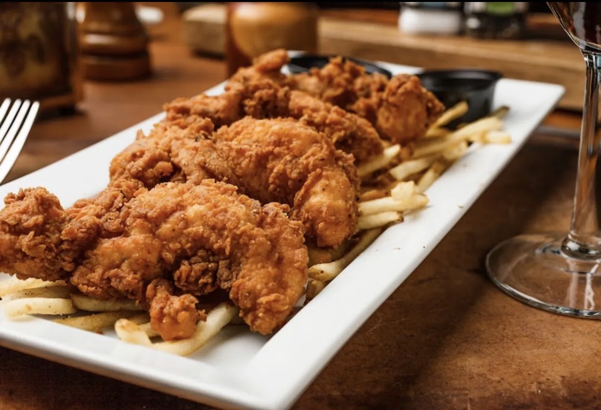 Ophelia’s Prime — fried chicken tenders over fries