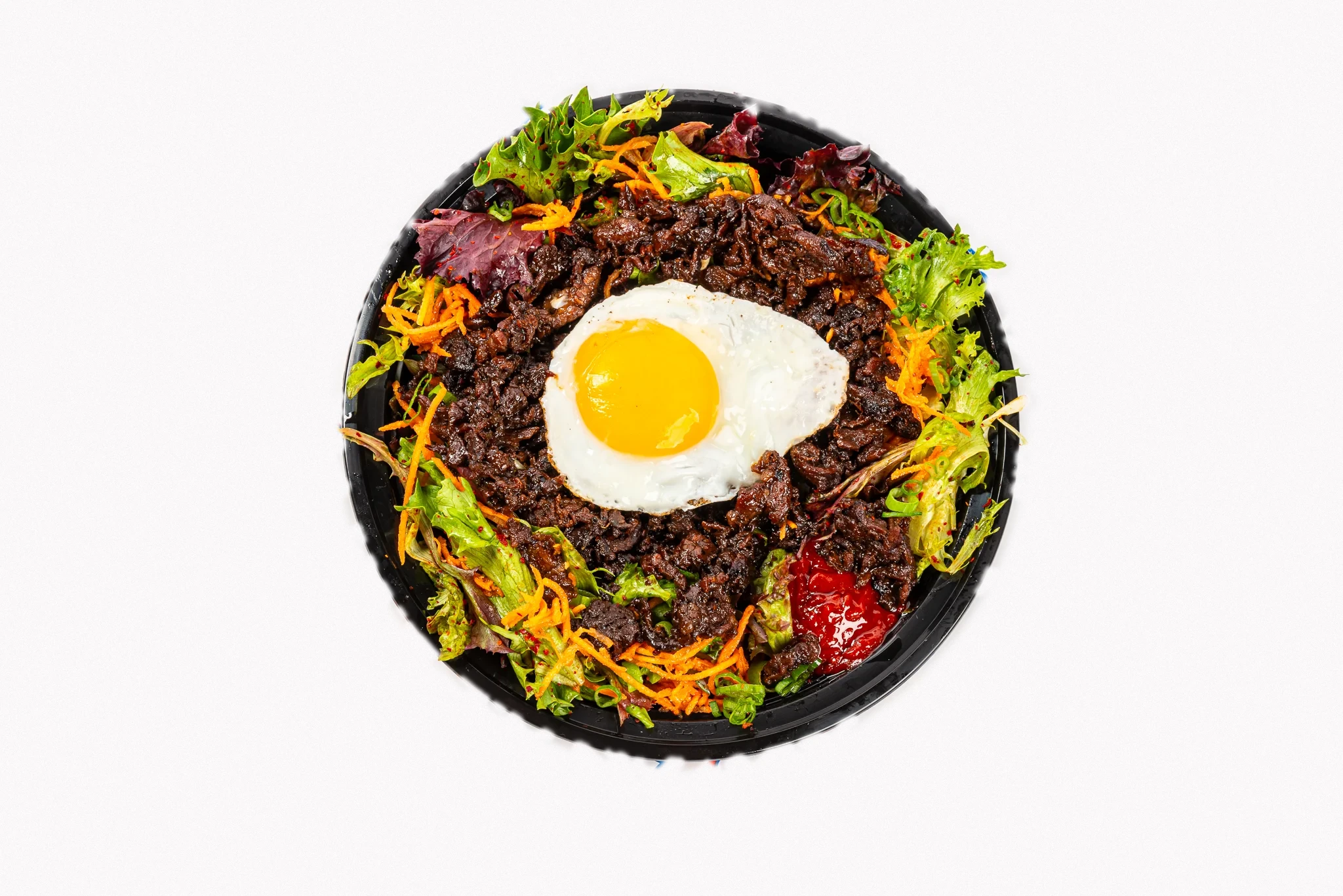 Gogi Bowl with bulgogi, salad, and sunny-side-up egg
