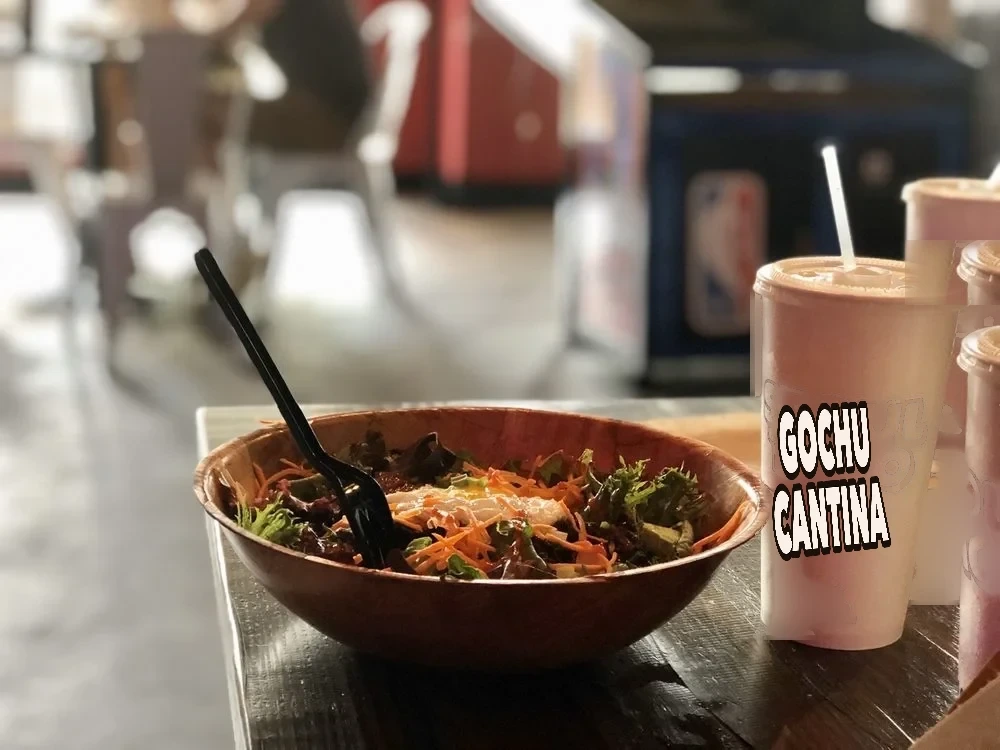Salad bowl with Gochu Cantina branded cups at the Example Location